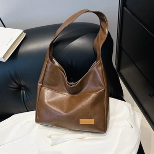 Brown vintage faux leather tote bag with large capacity for commuting and daily use