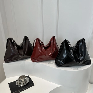 Minimalist large glossy leather tote bags in black and burgundy with adjustable straps