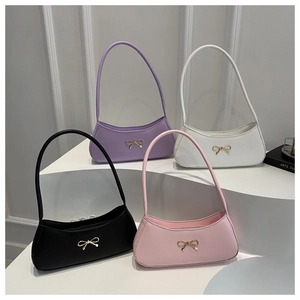 Selection of crescent shoulder bags in purple, white, black and pink with gold bows