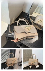 Detail of khaki patchwork box bag with sparkling flap and gold D-ring buckle
