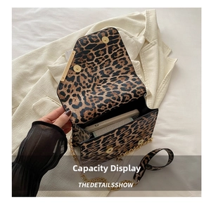 Internal capacity display of leopard print shoulder bag with gold chain and metal buckle