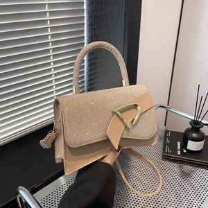 Fashionable champagne sequin crossbody bag with gold hardware and top handle strap