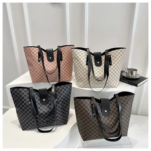 Detailed display of four patterned tote bags on a geometric stand in various colors