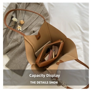 Interior view of brown tote bag showing large capacity with inner pouch and silk scarf