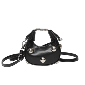 Minimalist black half-moon leather crossbody bag with silver studs and adjustable strap