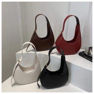 Collection of four minimalist crescent underarm bags in brown, red, beige, and black colors