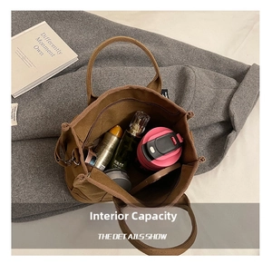 Top view of spacious canvas tote interior holding cosmetics, water bottle and daily essentials