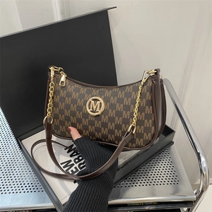 Chic brown crescent underarm bag with M-pattern print and gold logo detailing
