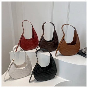 Detail showing woven texture and crescent shape of minimalist hobo bags in five colors