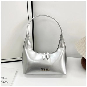Detail of silver metallic bag with dual zipper design and EL'DORA logo on a white background