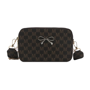 Vintage brown crossbody bag with letter M print, wide strap, and silver bow accent
