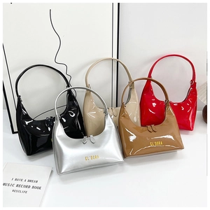 Close-up of shiny patent leather baguette bags in multiple colors with logo detail