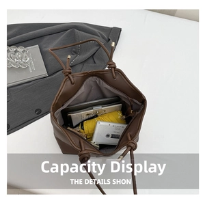 Detail view of large dark brown tote bag with ample space for tablet and essentials
