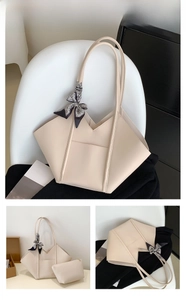 Detail view of cream-white tote bag and pouch set with geometric silk scarf decor