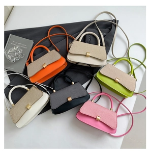 Detailed overhead view of small crossbody flap bags in six vibrant colors with metal clasps