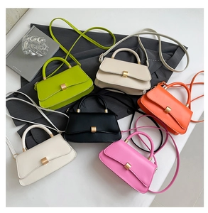Detailed view of fashionable mini crossbody bags in green, beige, black, orange and pink