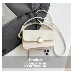 Detailed comparison of cream white crossbody bag with gold buckle and smartphone for scale