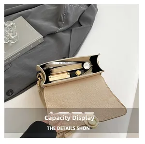 Interior view showing the capacity of this stylish cream crossbody bag with its striped lining