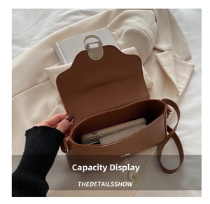 Internal view of caramel leather shoulder bag showing practical storage capacity