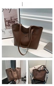 Detail of dark brown matte PU leather tote bag featuring a front snap pocket and slim straps