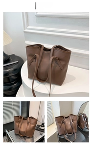 Close-up of coffee brown tote bag showing matte faux leather texture and brand lettering