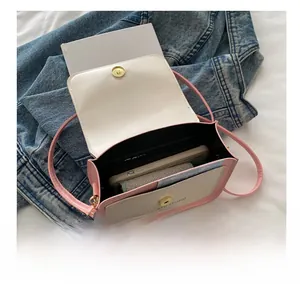 Internal view of pink and white crossbody bag showing storage space for daily essentials