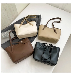 Top view of minimalist tote bags in cream, khaki, coffee, and black with adjustable handles