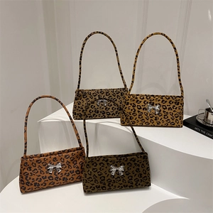 Leopard print baguette bags in four colors with silver bow decor and shoulder straps
