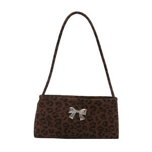 Leopard print shoulder bag featuring a silver metal bow accent on a minimalist silhouette