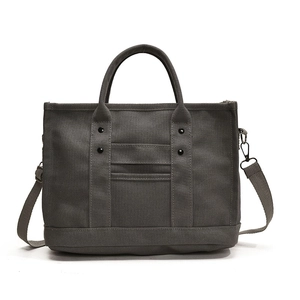 Dark grey canvas tote bag with adjustable shoulder strap for daily commuting