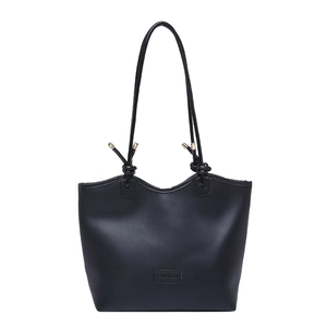Minimalist black tote bag with knot details and a metal-capped shoulder strap