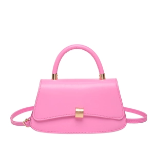 Vibrant pink leather mini satchel with top handle and gold hardware in crossbody style