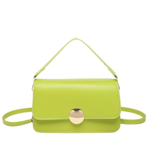Minimalist bright green leather handbag with gold metal clasp and crossbody strap