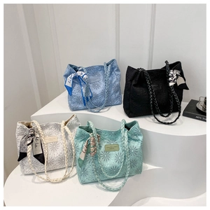 Four large capacity tote bags in sky blue, black, beige, and mint with daisy patterns