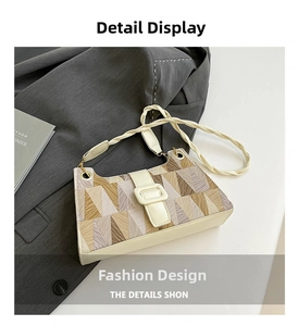 Detailed close-up of color-block geometric pattern and textured strap on the shoulder bag