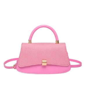Pink leather and textured fabric crossbody saddle bag with gold metal buckle
