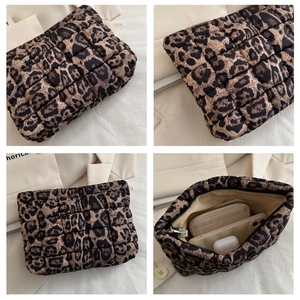 Detailed views of leopard print quilted clutch bag featuring spacious interior and zipper