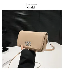 Detail view of khaki PU leather crossbody bag with silver buckle and adjustable strap