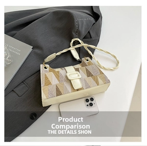 Detail of geometric pattern underarm bag with woven strap and premium textured finish