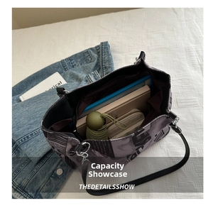 Interior view showing the large capacity of the newspaper print tote bag for daily essentials