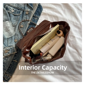 Top view of large capacity interior storage for brown quilted leather shoulder bag