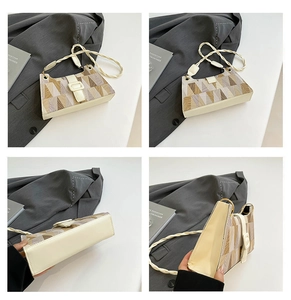Detail view of geometric patchwork shoulder bag showing woven handle and side structure