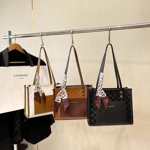 Three oversized checkered tote bags in brown and black with leopard print scarves