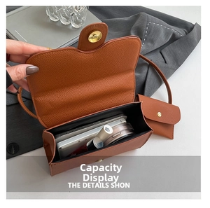 Internal storage view of brown lychee grain crossbody bag with matching mini pouch