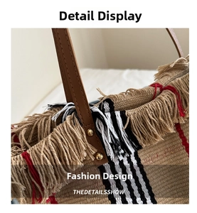 Close-up of checkered canvas tote bag with decorative tassels and leather handles