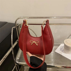 Elegant dark red crescent hobo bag with a golden bow metal buckle for women