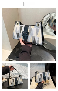 Macro detail of geometric patchwork shoulder bag with black buckle and metal eyelets