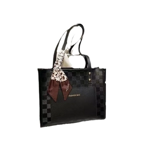 Large black tote bag with checkerboard pattern, silk scarf, and Fashion Bag print