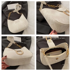 Detail view of cream marble texture PU leather underarm bag with gold chain and U-buckle