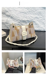 Detail view of off-white geometric patchwork bag with twisted shoulder strap and metal rings